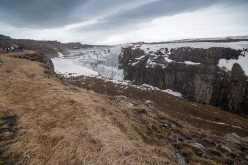 Amazing Icelandic winter landscape of majestic waterfall of frozen Gullfoss