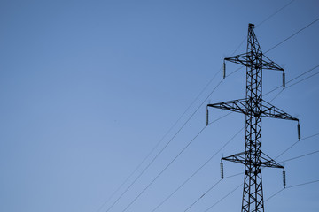 High voltage tower on the against the sky.