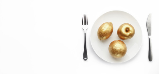 Golden fruits served on plate