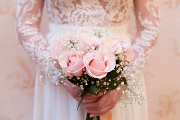 Beautiful  wedding bouquet of flowers in the hands of the bride