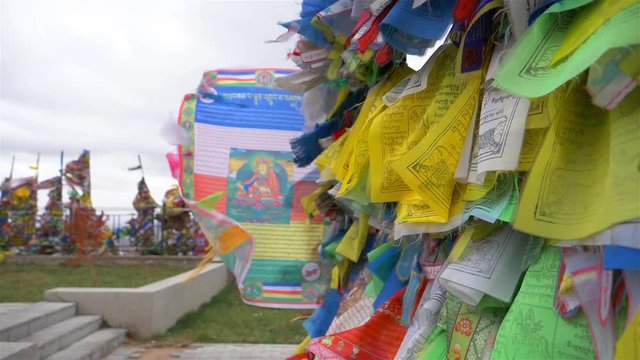 Colorful Tibetan prayer flags swaying in the wind in the temple, Ulan Ude Russia