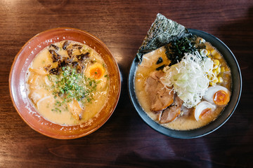 Top view of Ramen Pork Bone Soup (Tonkotsu Ramen) with Chashu Pork, Scallion, Sprout, Corn, Dried Seaweed and boiled eggs.