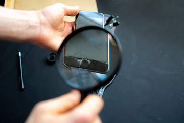 close up hands of a repair phone repair service worker b