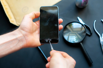 close up hands of a repair phone repair service worker b