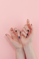 Woman's hands with black manicure