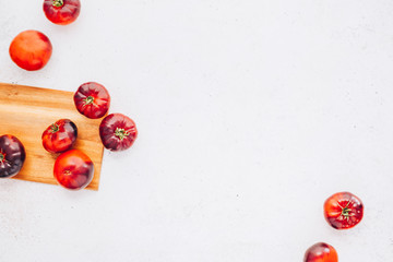 Tomatoes Mar Azul on white wooden table background