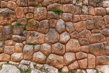 Inca wall in the ruins of Chinchero in Peru.