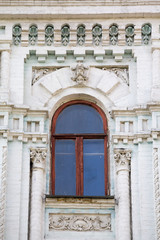 Old arched window in classical style. Architecture
