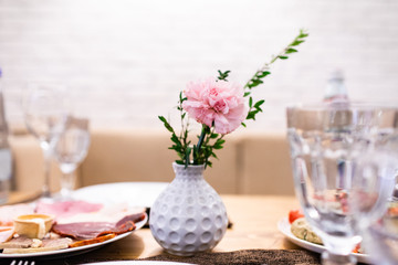 Wedding table in a restaurant with flower composition