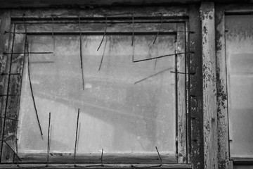 Monochrome old window in a wooden frame