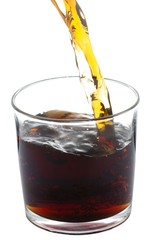 cola pouring into glass isolated on white background with clipping path