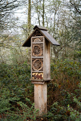 wooden birdhouse on tree