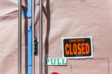 Business closed sign on the front door