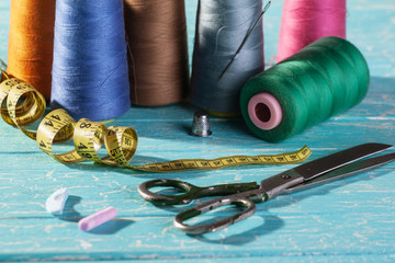 threads in coils on the background of wooden painted boards