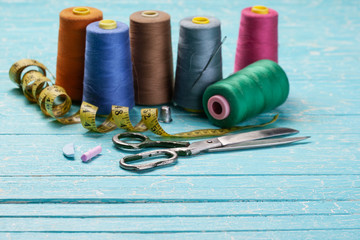 threads in coils on the background of wooden painted boards