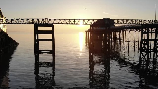 Gower lifeboat center sunrise under pier