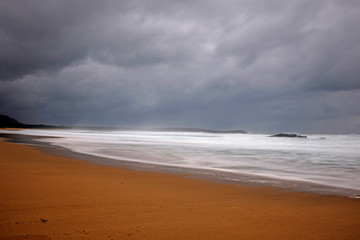 perspective of the shore of the beach