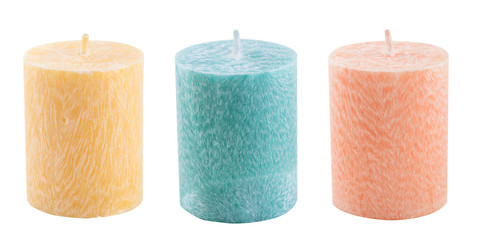 Three pastel aroma candles isolated on white