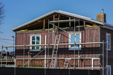 Obraz premium two-storey wooden dwelling house repair, attic thermic insulation