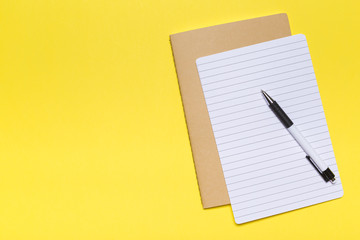school notebook on a yellow background