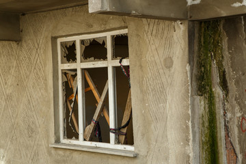 broken window of an unfinished house