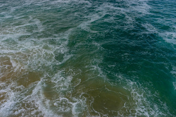 Fototapeta na wymiar Sea raging wild waves in the sea of the city of Santander, Spain