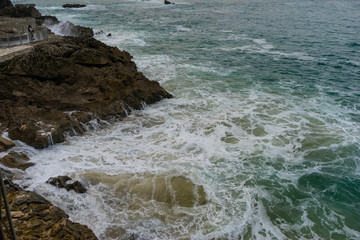 Rocks, Sea raging wild waves in the sea of the city of Santander, Spain