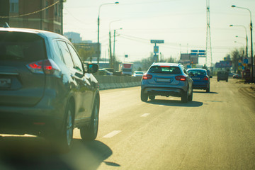 lurry and soft focus at many car on the main road. Copy space and Sunset Background. Driver perspective. Concept Holiday travel, Go back home , Missing home, Safety and dangerous on street