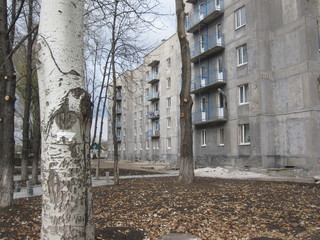 Aged dirty facade residential building, multi-storey house, soviet architecture. Front view close...