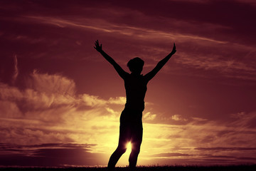 Fototapeta premium Pose yoga sunset in the field slim athletic girl
