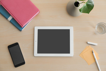 Flat lay composition with modern tablet on table. Space for design