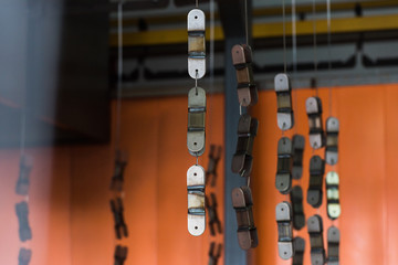 Obraz premium Details on the conveyor before painting. Automatic powder coating and surface preparation line.