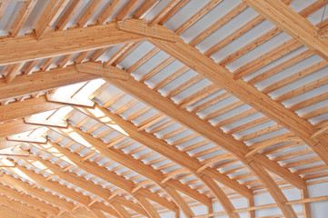 Roof construction of laminated veneer lumber. Building. Glued laminated timber. Building. Construction site 