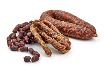 Different types of smoked sausages, close-up, isolated on white background