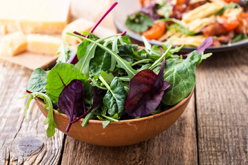 Fresh salad in ceramic bowl, healthy plant-based meal
