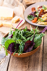 Fresh salad in ceramic bowl, healthy plant-based meal