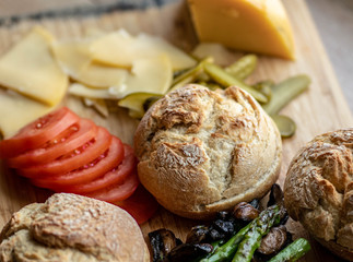 Baked portobello mushroom burger with addition fresh lettuce, tomato, asparagus and fresh spinach leaves