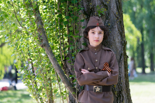 Portrait Of A Boy In The Uniform Of A Soldier Of The Red Army During The Second World War.