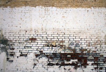 old brick wall painted white