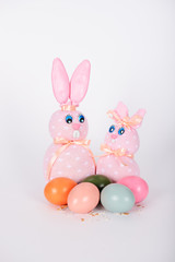 The pink easter male and female hand-made bunnies and easter eggs