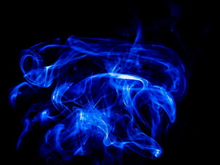 Blue smoke on black background