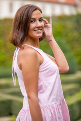 Portrait of young woman in Wallenstein garden in Prague, Czech Republic