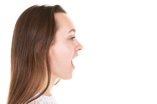 Profile of an angry young woman shouting in white background