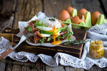 sandwich with avocado, cheese, ham and egg