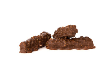 Chocolate bar on a white background. Candy with peanuts and raisins, caramel, puffed rice waffles, in chocolate isolated on white background.