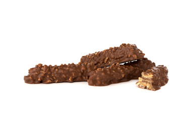 Chocolate bar on a white background. Candy with peanuts and raisins, caramel, puffed rice waffles, in chocolate isolated on white background.