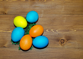 colorful easter eggs on wooden background