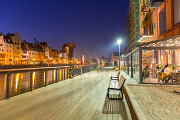 Fototapeta na wymiar Architecture of the old town of Gdansk with historic Crane at Motlawa river, Poland