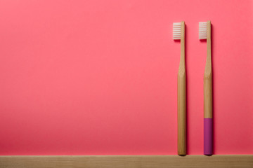 bamboo toothbrushes on pink background. Place for text. Ecoproduct.   eco-friendly