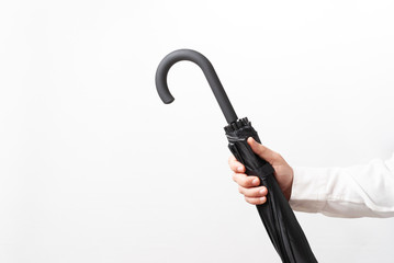 Man holding closed umbrella © Ion Creations